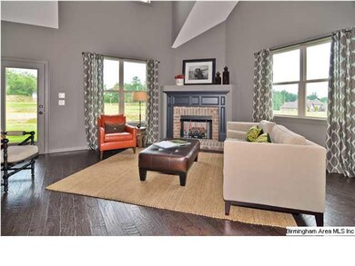 Living room with gas fireplace, handscraped hardwo