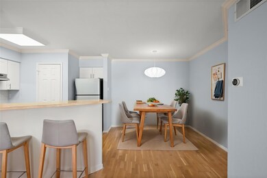 Dining space with light wood-style flooring, base