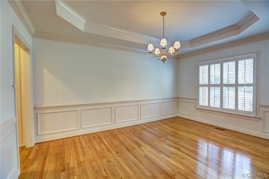 Dining Room: tray ceiling,crown,chair,picture mold