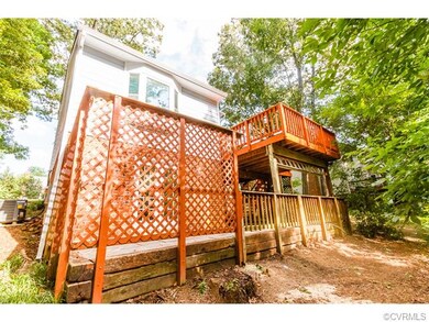 EXTERIOR BACK W/ LARGE DECK & PATIO, WALK-OUT BASE