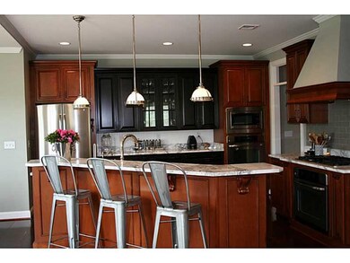 Kitchen. Chef s kitchen with gas stove, custom cab