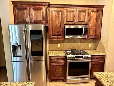 Kitchen has newer stainless steel appliances, incl