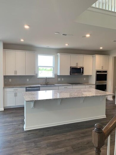 Gourmet kitchen with double wall oven and cooktop!