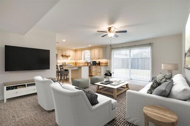 Virtually Staged Living Room Open to Kitchen