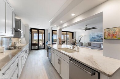 Kitchen featuring backsplash, black electric cookt