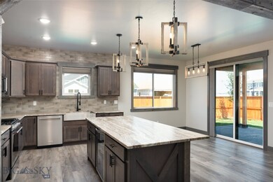 Kitchen and Dining with Custom Lighting and Beauti