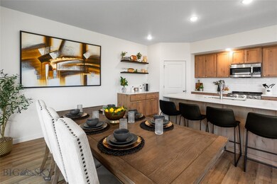 Dining room with dark hardwood / wood-style floors