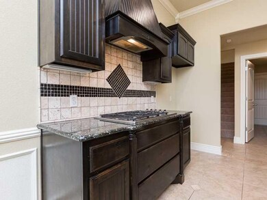 Kitchen. Top of the line granite counter tops and a 5 burner gas stove top