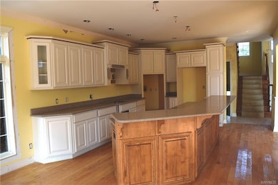 Kitchen with granite countertops and hardwood floo
