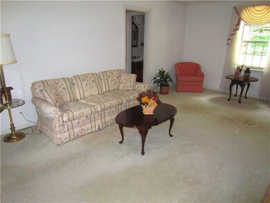 Living Room. Lots of Windows fill the room with Na