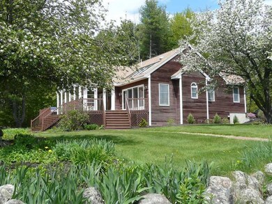 Exterior Back. With apple trees and...