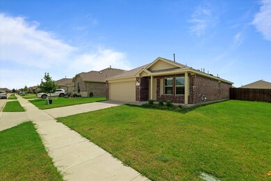 Ranch-style house with a front lawn and a garage