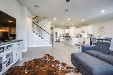 Open concept Living room with plenty of light.  Pe