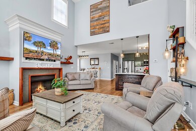 Living room with hardwood / wood-style floors and 