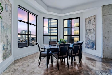 Dining room featuring concrete flooring