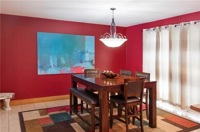 Large eat in kitchen area, with doors leading to t