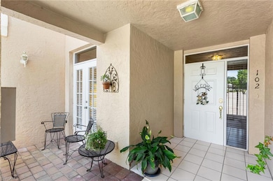 Entrance to property with stucco siding and french doors