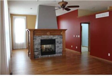 living room with 2 way fireplace