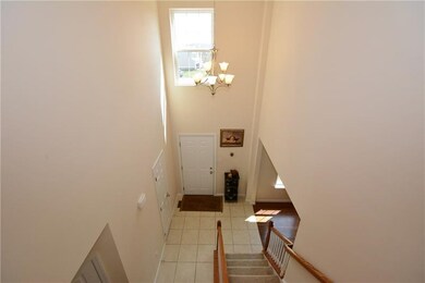 Window and larger delicate chandelier complete the