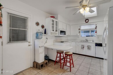 White kitchen cabinetry and appliances