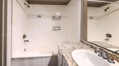 Bathroom with vanity and shower / bathing tub comb