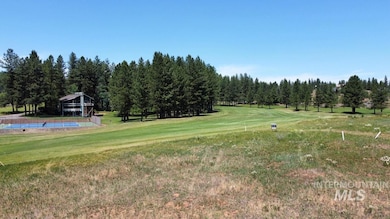 View of grassy yard featuring a gazebo and view of golf course