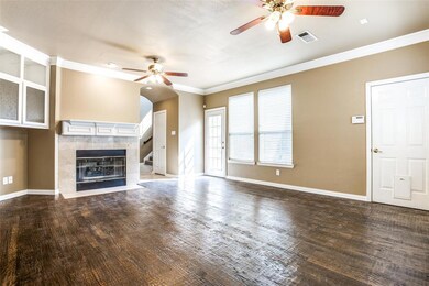 Fireplace and hand-scraped hardwood floors in the 