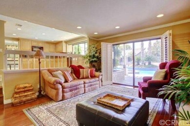 Family Room with hardwood floor, plantation shutte