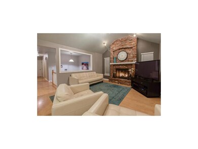 Great Room with Vaulted Ceiling & Wood Burning Fir