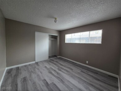 Unfurnished bedroom featuring wood finished floors