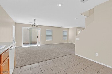 Unfurnished living room featuring light carpet, a