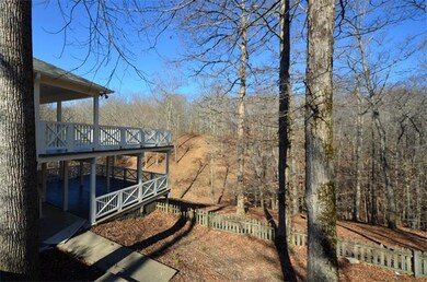 Huge double decks overlooking picturesque creek and 5 wooded acres. Everything in sight is included! 