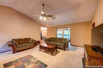 Kitchen/dining area to left; sunrrom behind and bedrooms to right