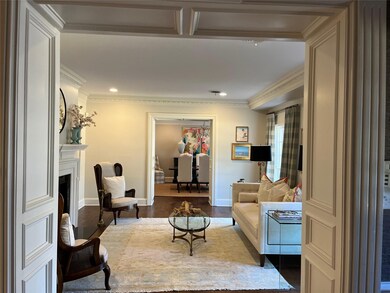 Living room featuring a fireplace with flush heart