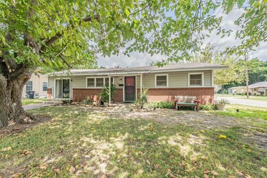 Ranch-style home with a front yard