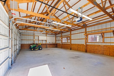 3-car garage with windows and wired for 220v power.