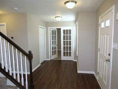 Impressive foyer with French door access to the de