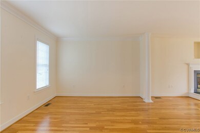 The Living Room features ceiling molding and state
