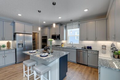 The kitchen has ample counter space and cabinets f