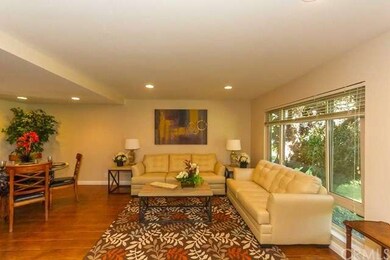 Living room is adjacent to formal dining room