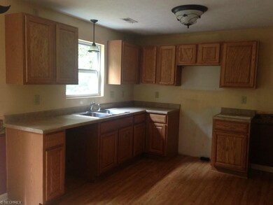 The kitchen features plenty of cabinet space!