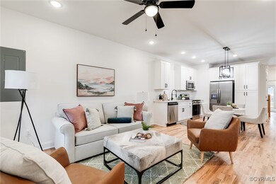 Living room with light wood-type flooring, ceiling