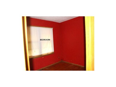 One of the bedrooms, hardwood floors