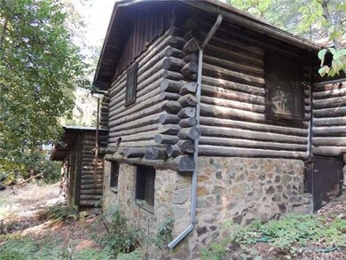 Log Home side view with rock detail