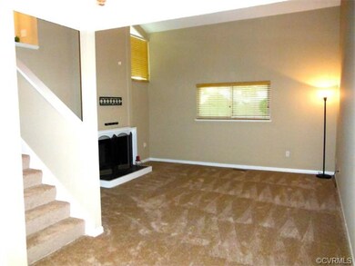 Great room features new carpet, vaulted ceiling, &