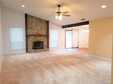 dimmable lights, ceiling fan, vaulted ceiling, stone gas fireplace, huge family room, opens to study and dining area.