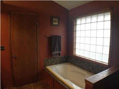 Master bath with glass block window