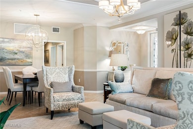 Tiled living room featuring baseboards, a notable