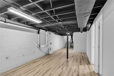 Finished below grade area featuring light wood-style floors