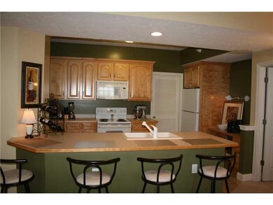 Kitchen. Gorgeous kitchen incorporates island seat